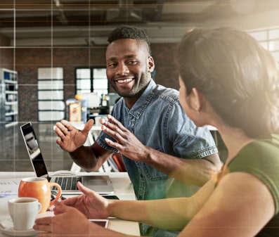 A calculator and coins next to a phone showing Facebook and Instagram ads
